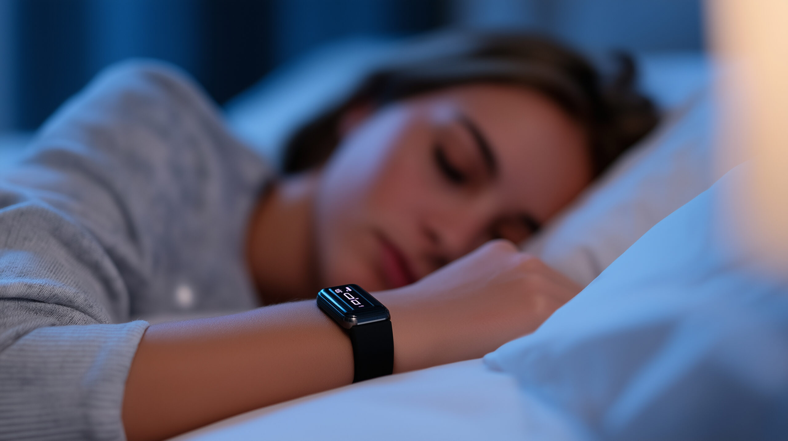 Woman sleeping with wearable device